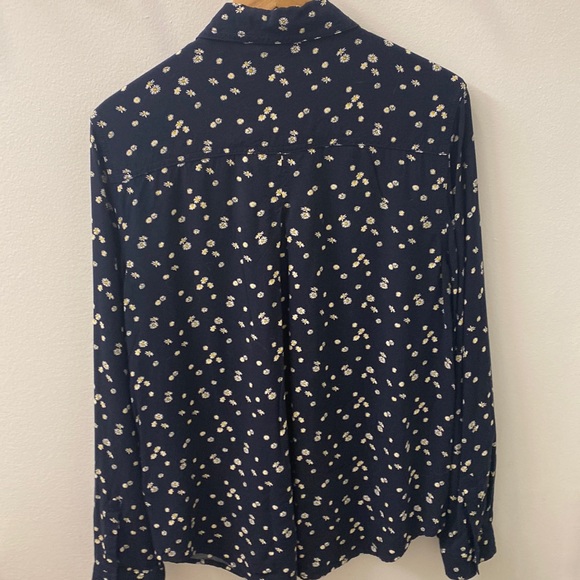 It’s a flowery navy shirt from the beachlunchlounge collection it’s medium. - Picture 3 of 3